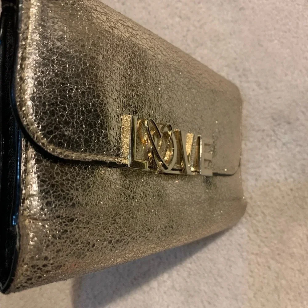 VICTORIA’S Secret shimmer phone wallet, golden